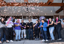 Staff and community members celebrate the grand opening of the city of Lawrenceville's first Xfinity store.