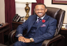 Forner Morris Brown College President Kevin James sits in a chair