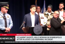A televised press conference shows Minneapolis city officials at a podium as local law enforcement and community members stand behind, with a news chyron reporting that an ICE agent shot and killed a woman in an alleged car‑ramming incident in Minneapolis.